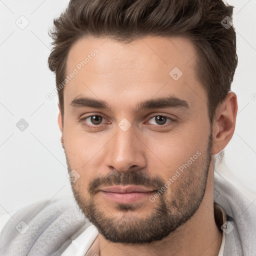 Joyful white young-adult male with short  brown hair and brown eyes