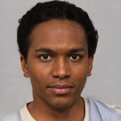 Neutral black young-adult male with short  black hair and brown eyes