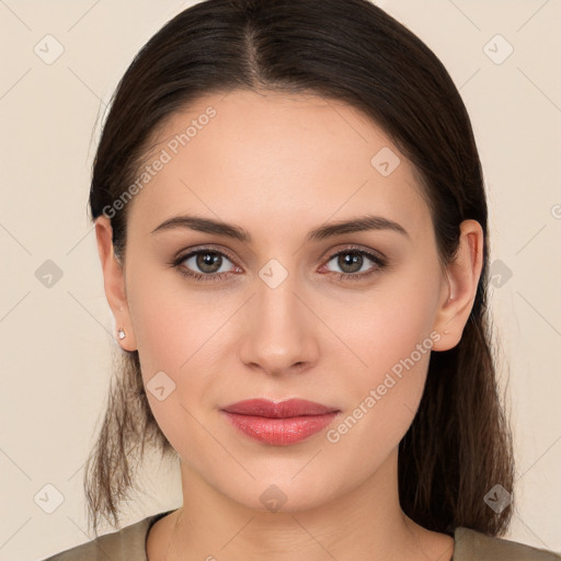 Joyful white young-adult female with long  brown hair and brown eyes