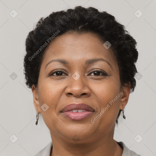 Joyful black adult female with short  brown hair and brown eyes