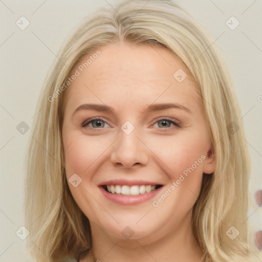 Joyful white young-adult female with long  brown hair and blue eyes