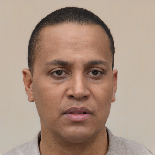 Neutral latino adult male with short  black hair and brown eyes