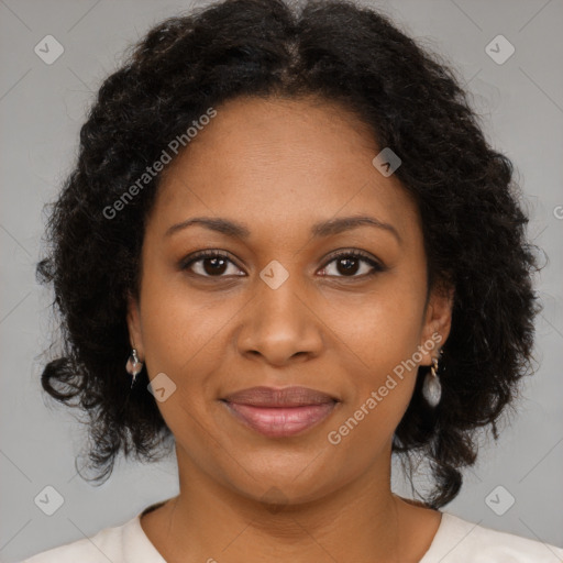 Joyful black adult female with medium  brown hair and brown eyes