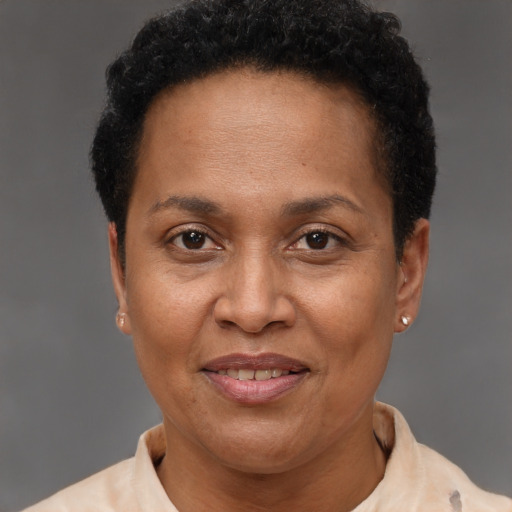 Joyful latino adult female with short  brown hair and brown eyes