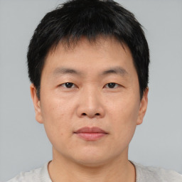 Neutral asian young-adult male with short  brown hair and brown eyes