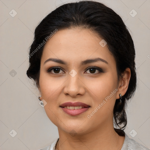 Joyful latino young-adult female with medium  black hair and brown eyes