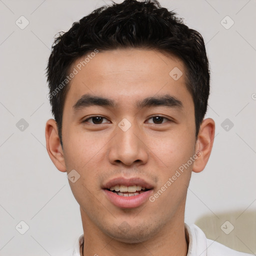 Joyful white young-adult male with short  black hair and brown eyes