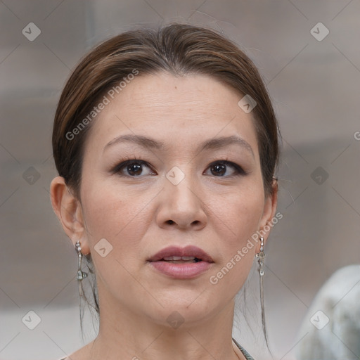 Joyful white adult female with medium  brown hair and brown eyes