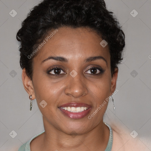 Joyful black young-adult female with short  brown hair and brown eyes
