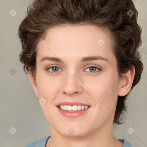 Joyful white young-adult female with medium  brown hair and green eyes