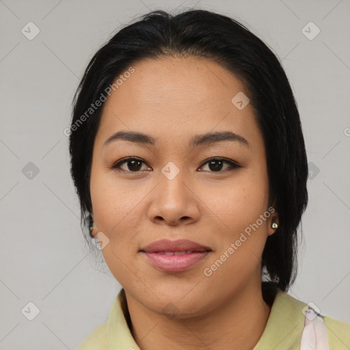 Joyful latino young-adult female with medium  black hair and brown eyes