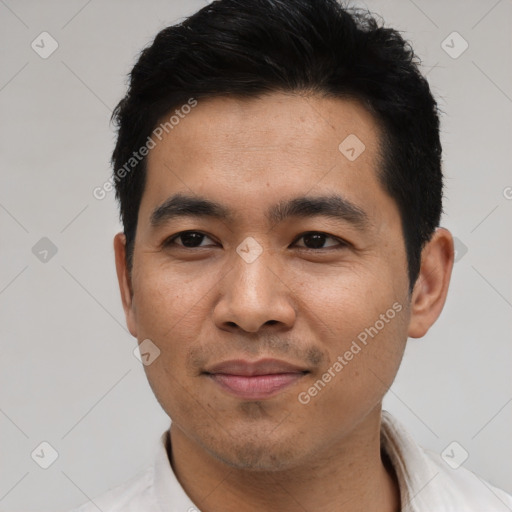 Joyful asian young-adult male with short  black hair and brown eyes