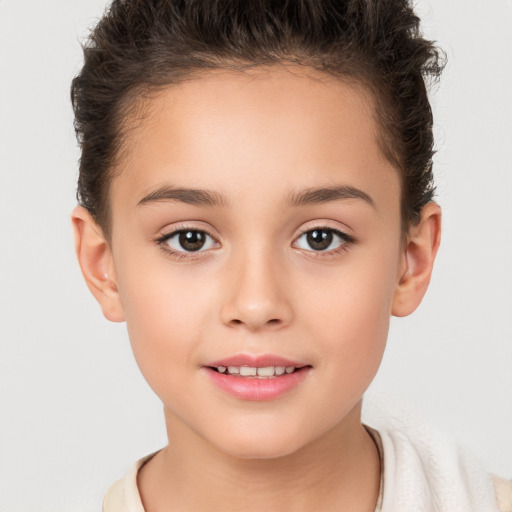 Joyful white child female with short  brown hair and brown eyes