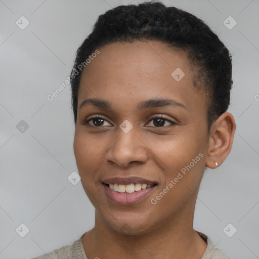 Joyful black young-adult female with short  black hair and brown eyes