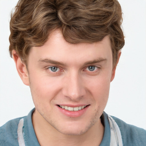 Joyful white young-adult male with short  brown hair and blue eyes