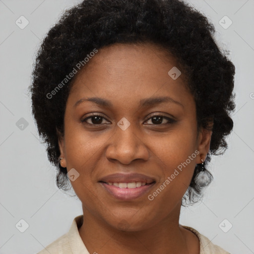 Joyful black adult female with short  brown hair and brown eyes