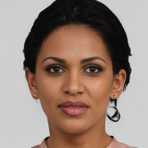 Joyful latino young-adult female with short  black hair and brown eyes