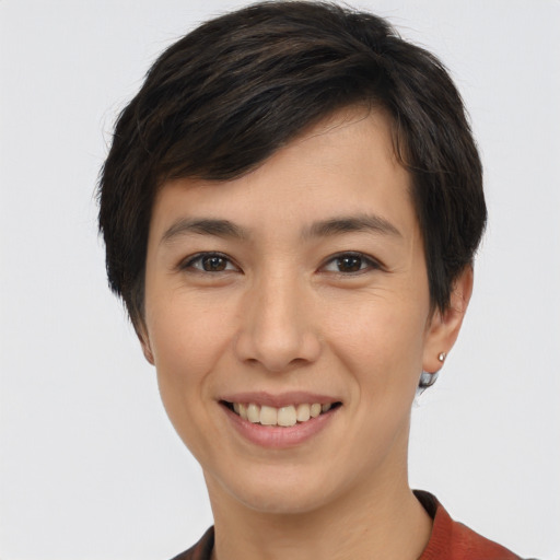 Joyful white young-adult female with short  brown hair and brown eyes