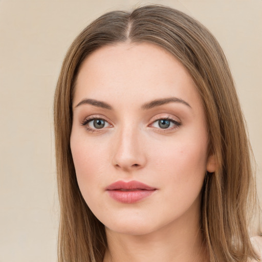 Neutral white young-adult female with long  brown hair and green eyes