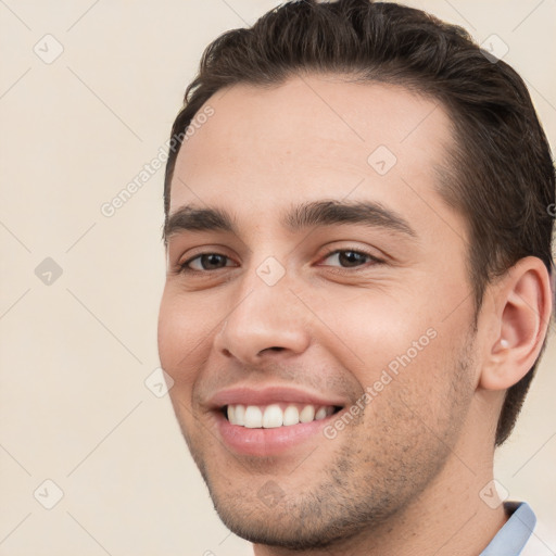 Joyful white young-adult male with short  brown hair and brown eyes