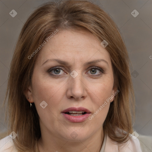 Joyful white adult female with medium  brown hair and brown eyes