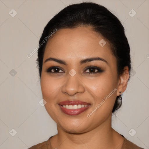 Joyful latino young-adult female with medium  brown hair and brown eyes