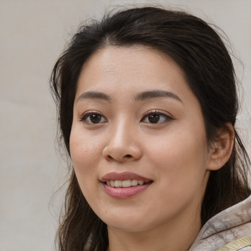 Joyful white young-adult female with medium  brown hair and brown eyes