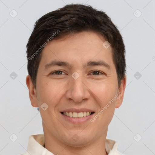 Joyful white adult male with short  brown hair and brown eyes