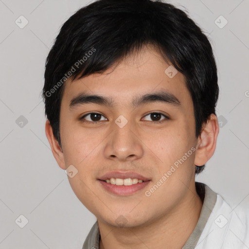 Joyful asian young-adult male with short  black hair and brown eyes