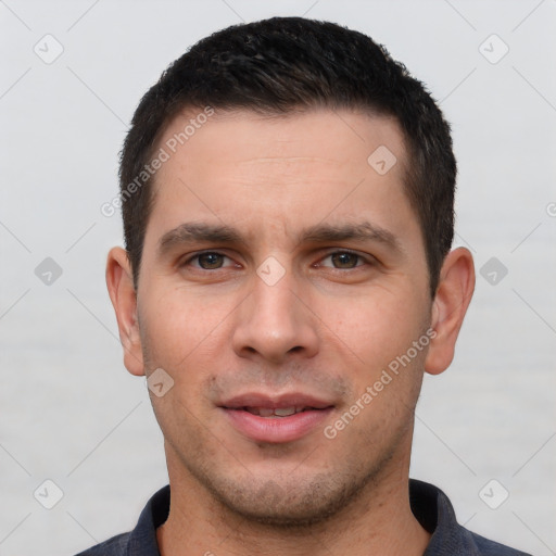 Joyful white young-adult male with short  brown hair and brown eyes