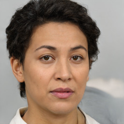 Joyful white adult female with short  brown hair and brown eyes