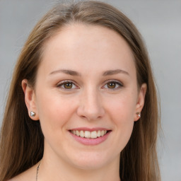 Joyful white young-adult female with long  brown hair and grey eyes