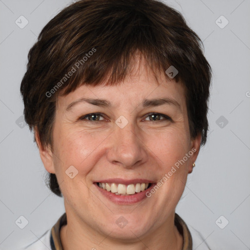 Joyful white adult female with short  brown hair and brown eyes