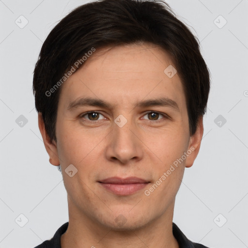 Joyful white adult male with short  brown hair and brown eyes