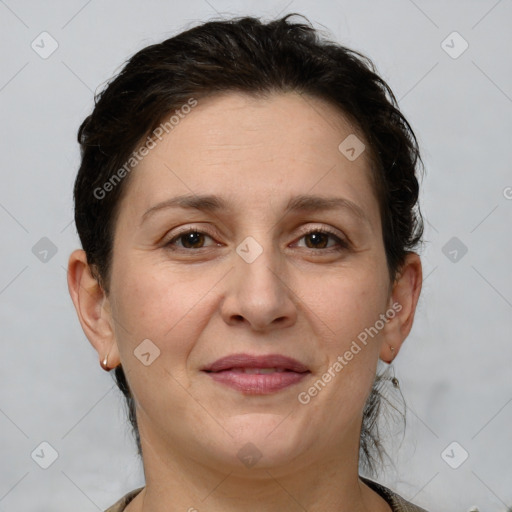 Joyful white adult female with short  brown hair and brown eyes