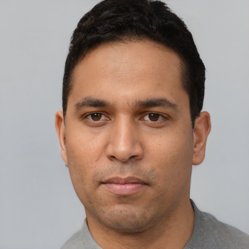 Neutral white young-adult male with short  black hair and brown eyes