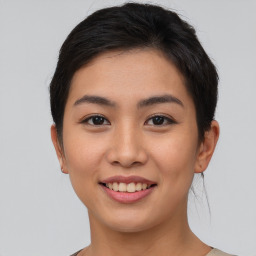 Joyful asian young-adult female with short  brown hair and brown eyes