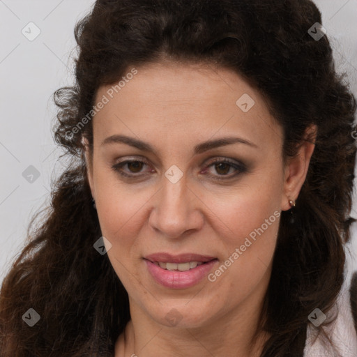 Joyful white adult female with long  brown hair and brown eyes