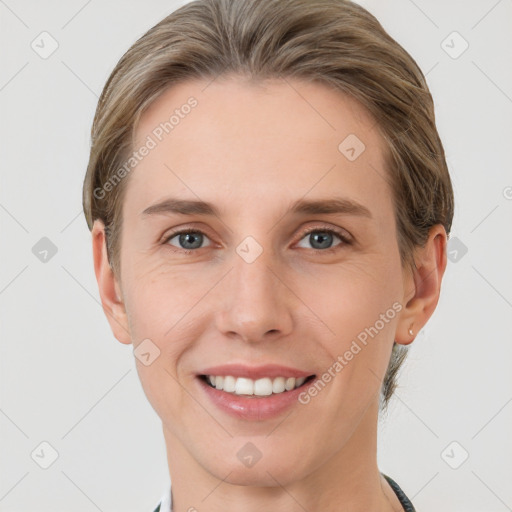 Joyful white young-adult female with medium  brown hair and grey eyes