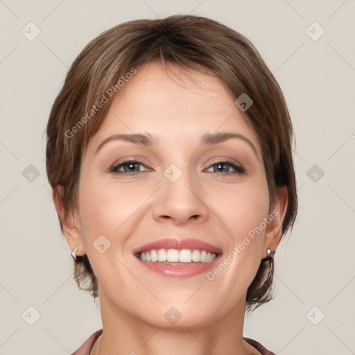 Joyful white young-adult female with short  brown hair and grey eyes