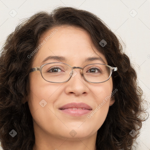 Joyful white adult female with long  brown hair and brown eyes