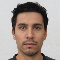 Neutral latino young-adult male with short  black hair and brown eyes