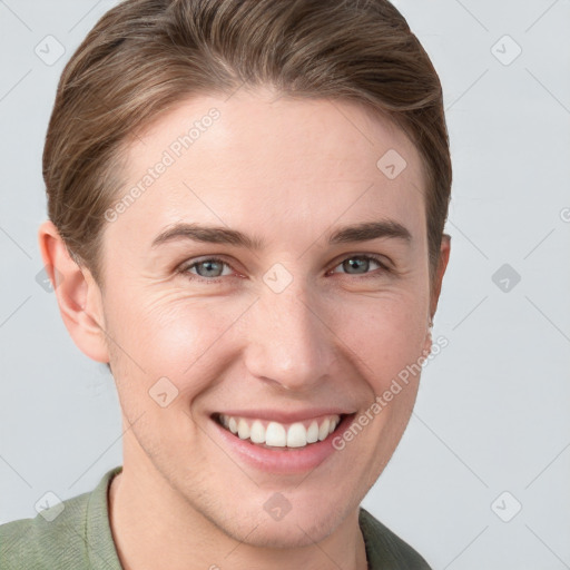 Joyful white young-adult female with short  brown hair and grey eyes