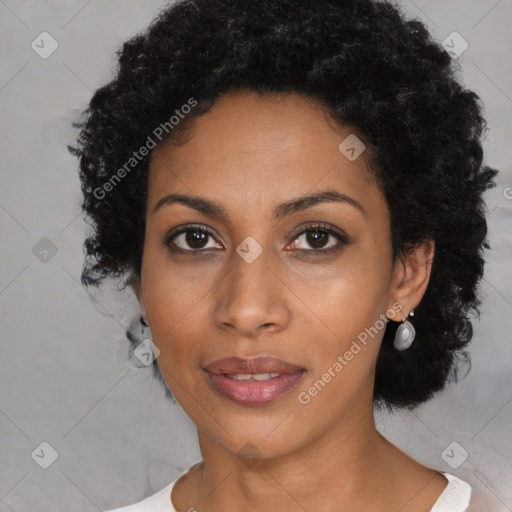 Joyful black young-adult female with medium  black hair and brown eyes