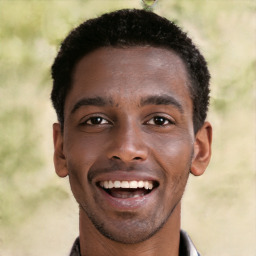 Joyful black young-adult male with short  brown hair and brown eyes