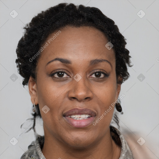 Joyful black adult female with short  brown hair and brown eyes