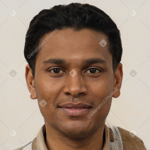 Joyful black young-adult male with short  black hair and brown eyes