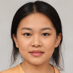 Joyful asian young-adult female with medium  brown hair and brown eyes