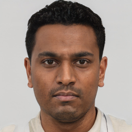 Neutral latino young-adult male with short  black hair and brown eyes