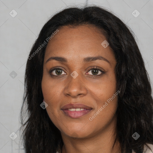 Joyful black young-adult female with long  black hair and brown eyes